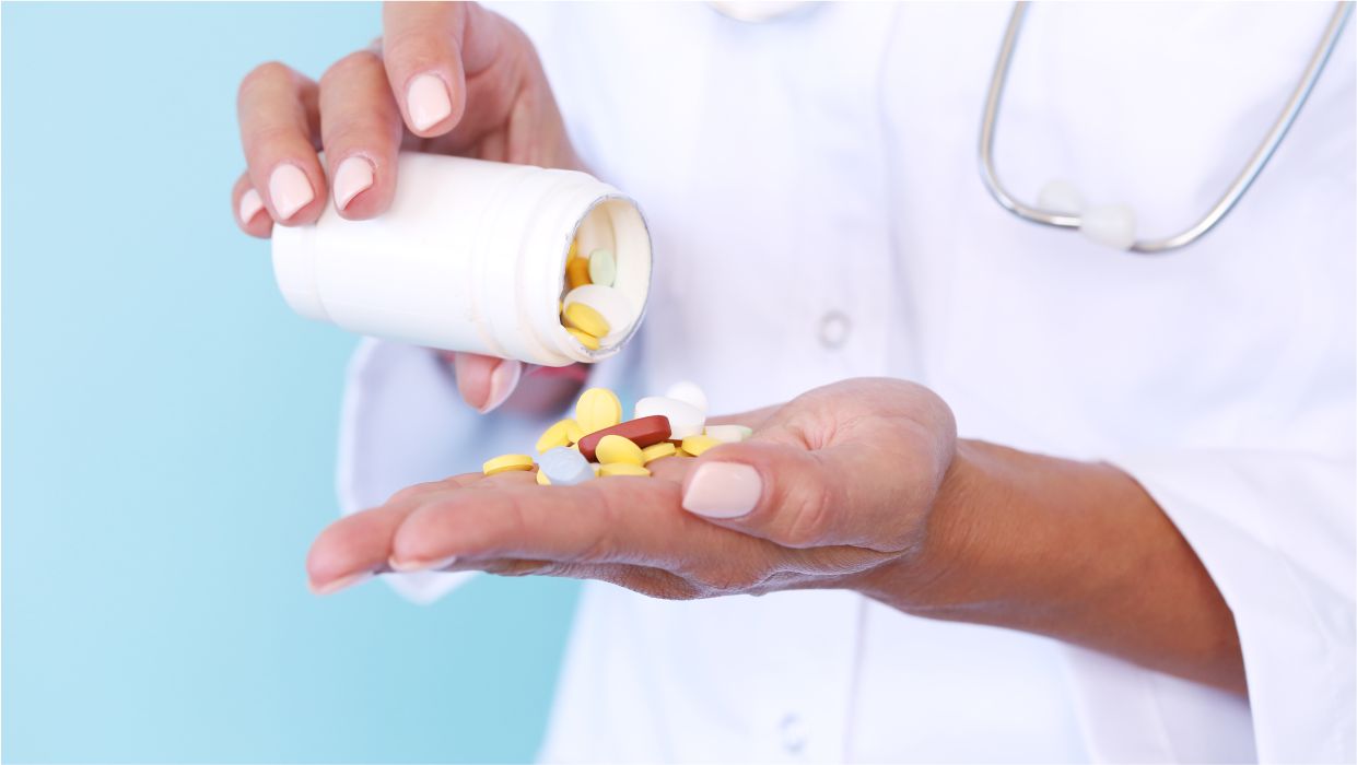 image of a nurse holding drugs